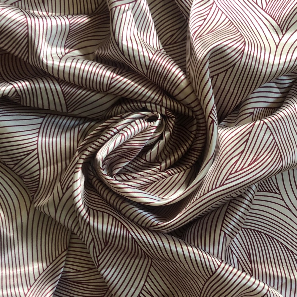 Beautiful ecru-burgundy wave charmeuse fabric sew